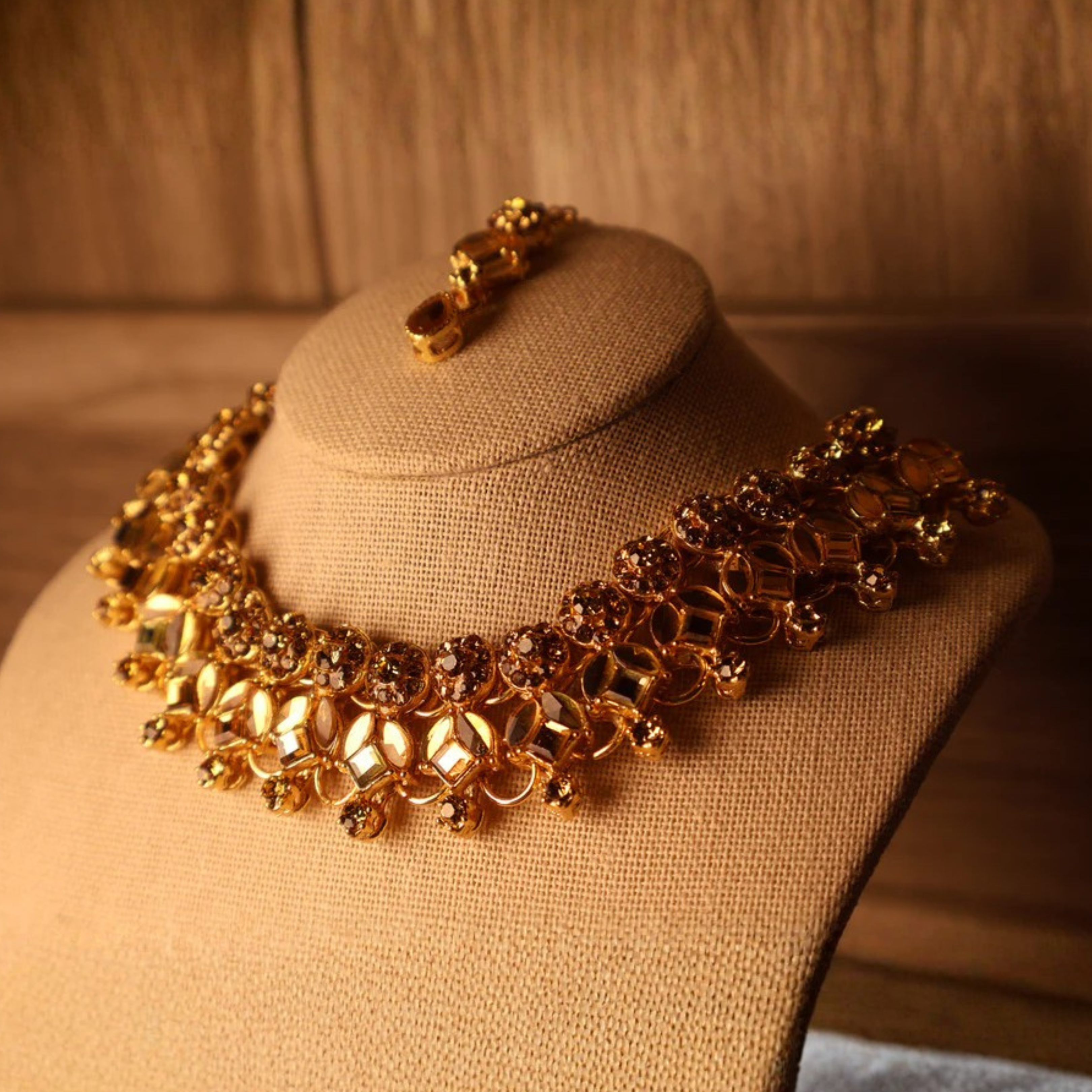 MUMTAZ champagne and gold kundan-style set with long drop earrings and tikka