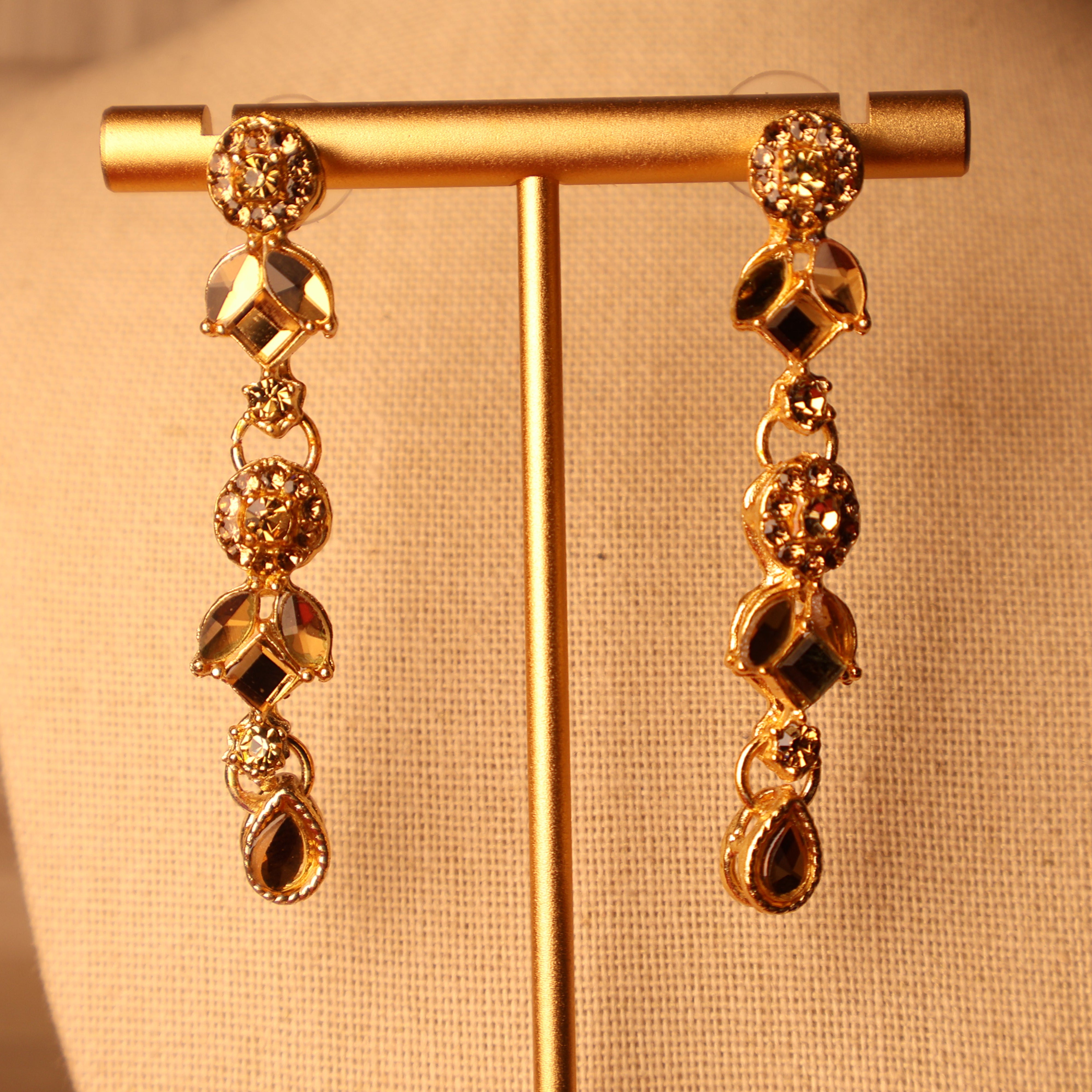 MUMTAZ champagne and gold kundan-style set with long drop earrings and tikka