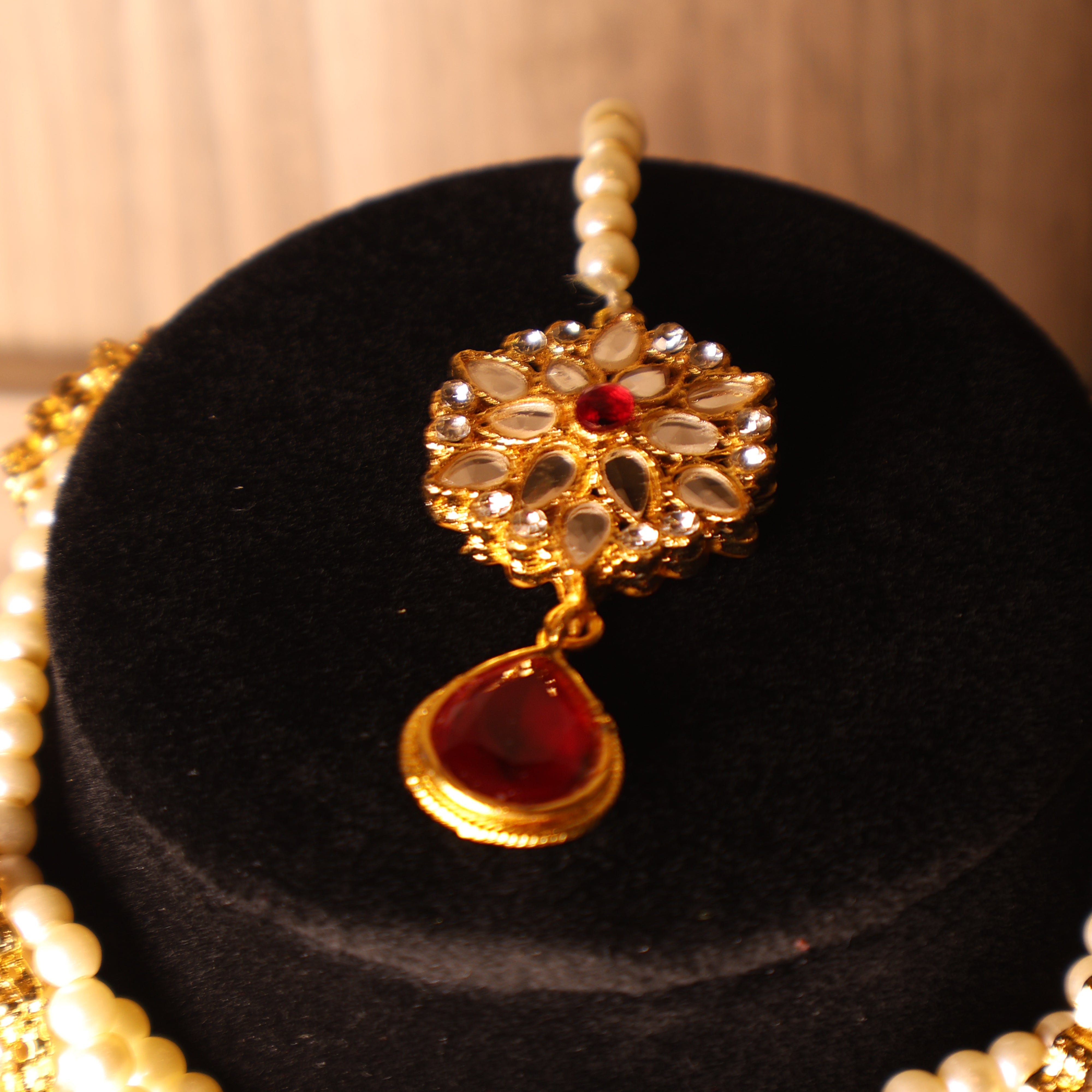 YAQOOT ruby red pearl and gold kundan-style choker set with tikka and earrings
