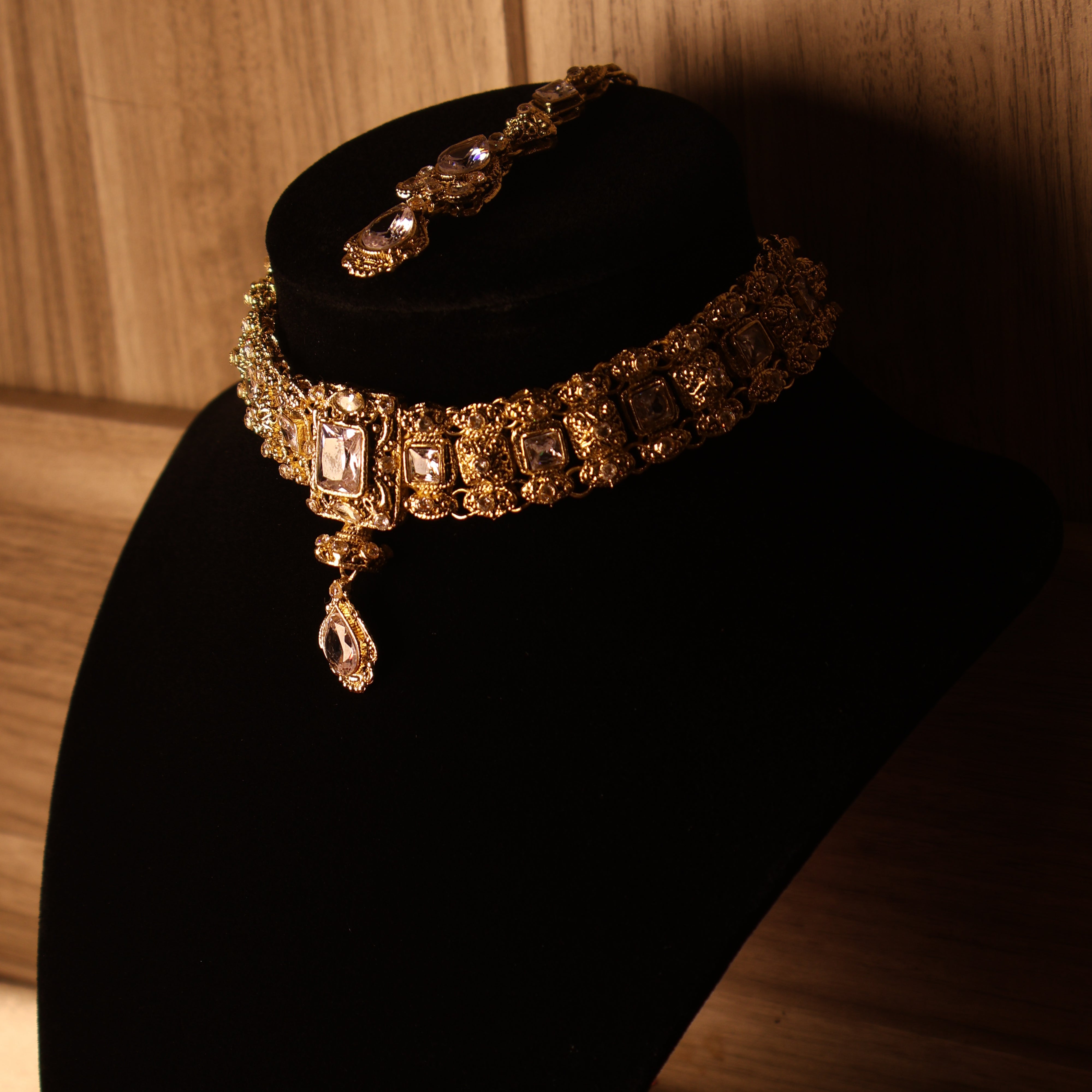 NAAZ light pink and gold kundan-style choker set with tikka and earrings
