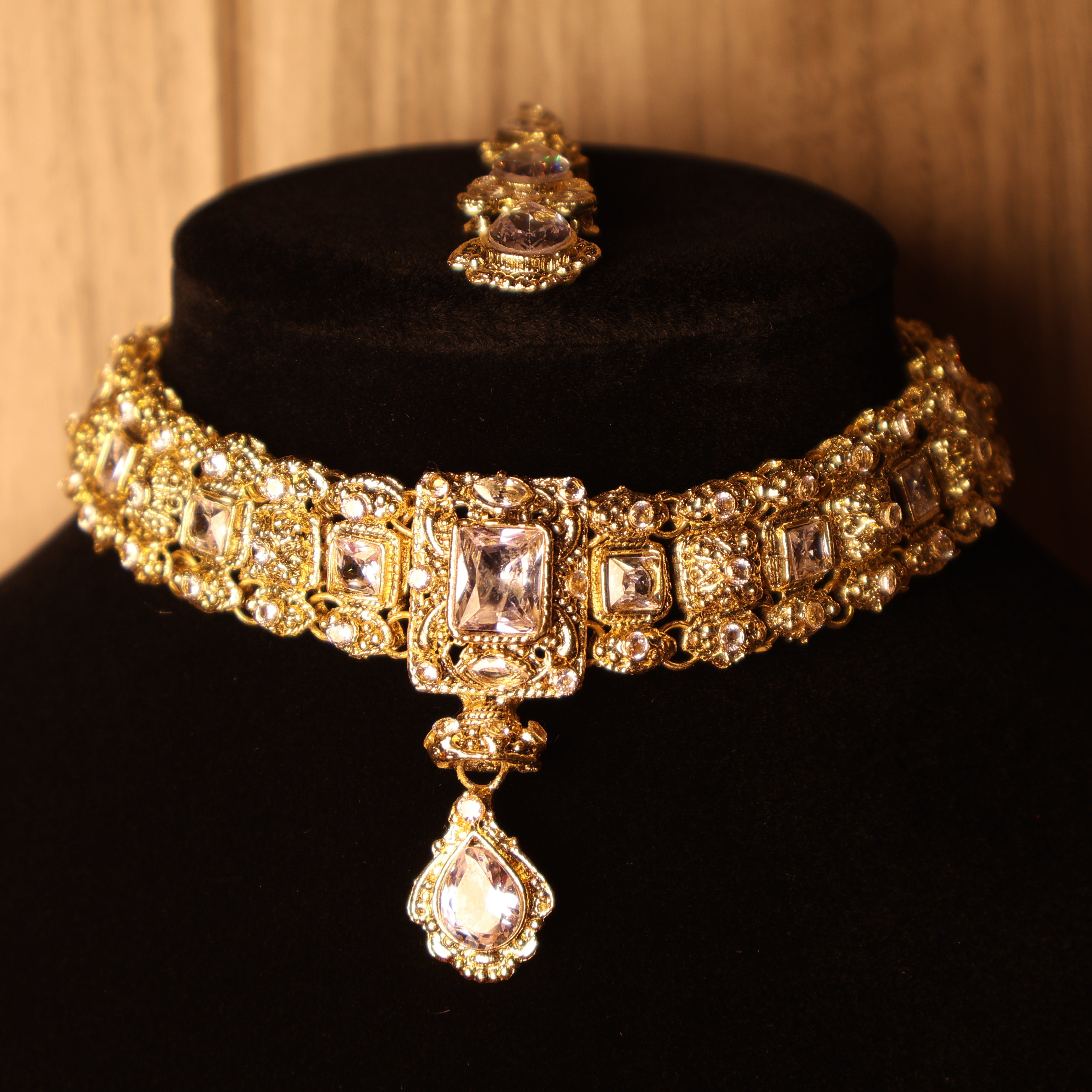 NAAZ light pink and gold kundan-style choker set with tikka and earrings