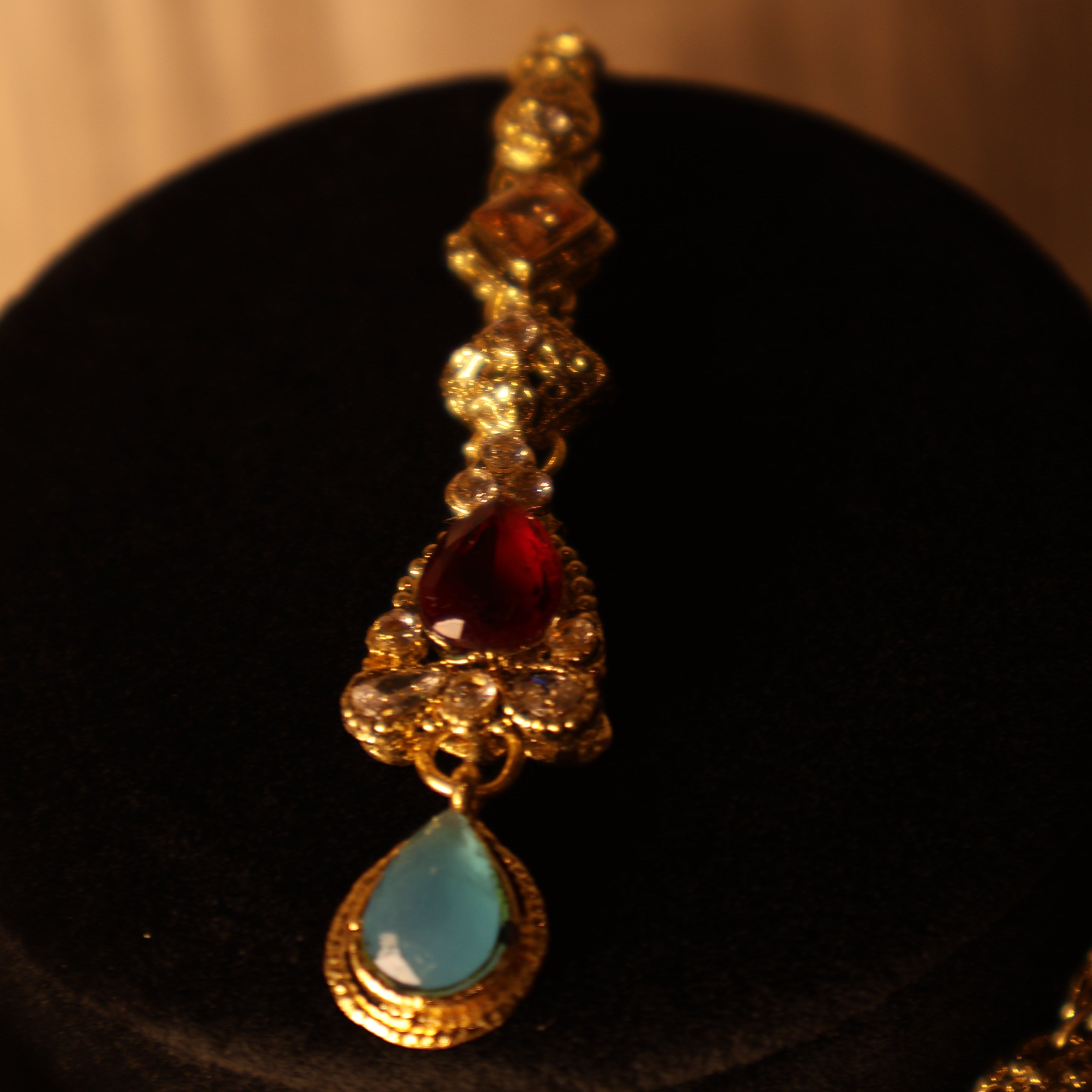 SITARA red, blue and gold kundan-style choker set with tikka and earrings