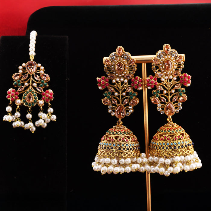A ZARIAH Anarkali full set laid out, including its matching maang tikka for the forehead