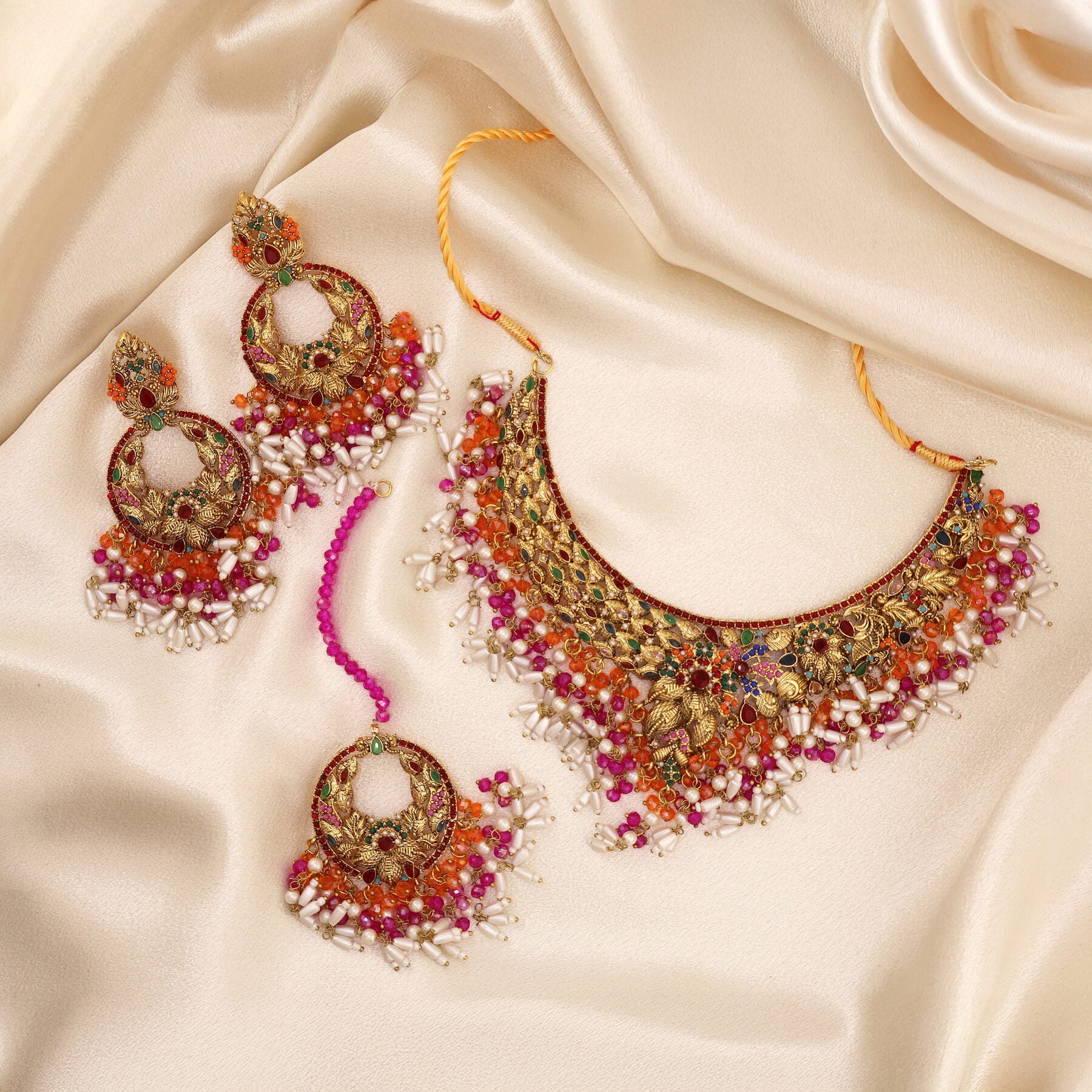 A ZARIAH handcrafted kundan-style bridal full set on satin