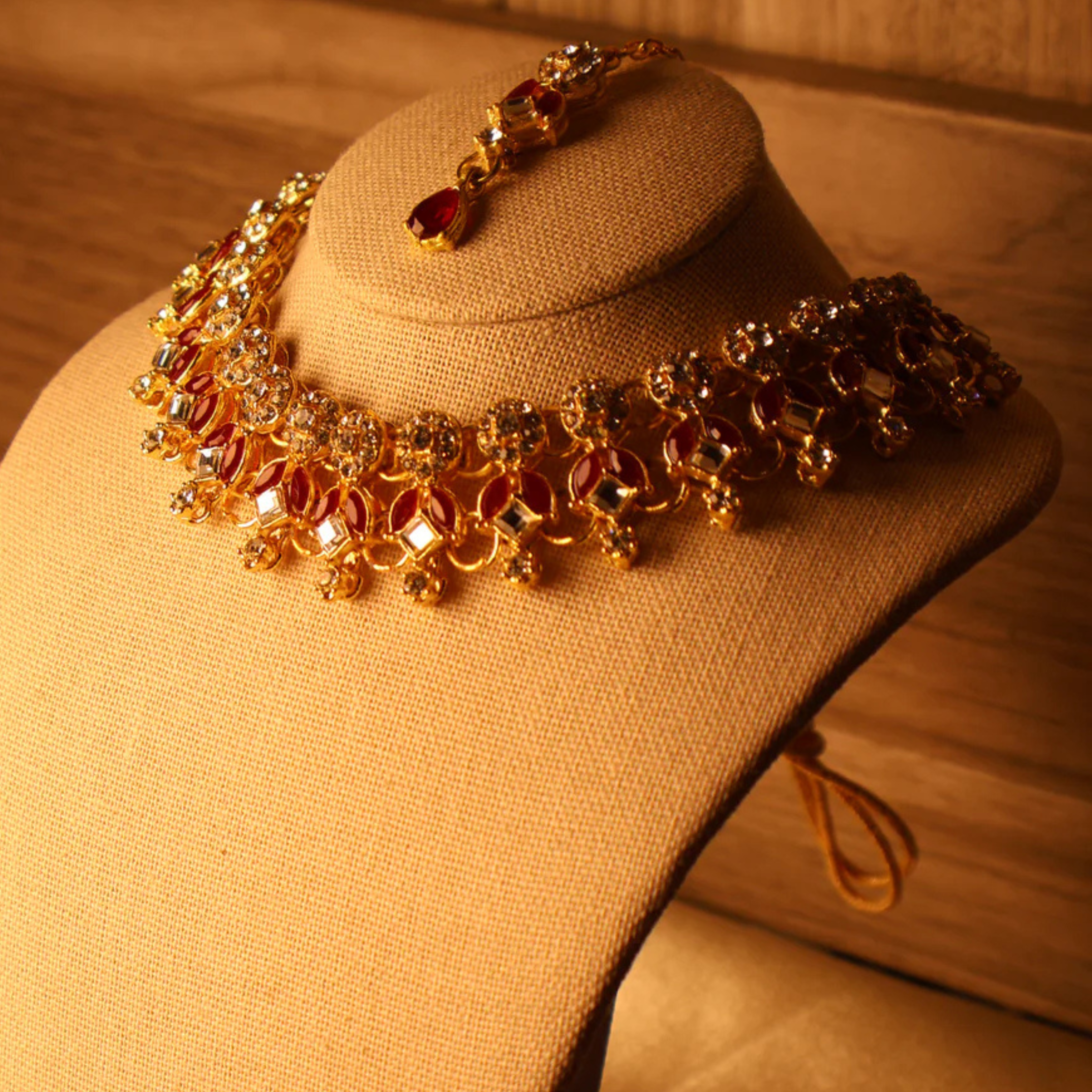 LAAL red and gold kundan-style bridal necklace set with tikka and earrings