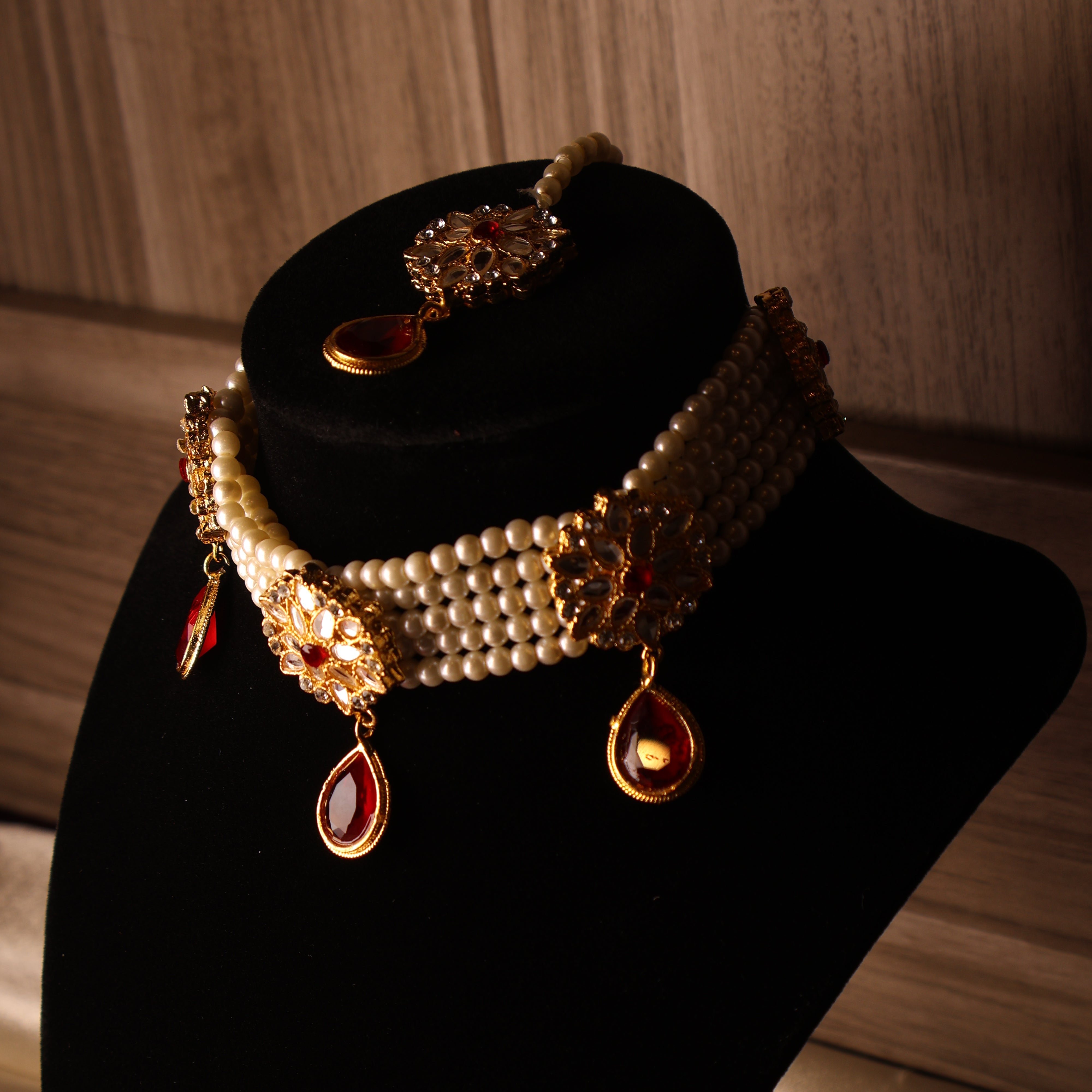 YAQOOT ruby red pearl and gold kundan-style choker set with tikka and earrings