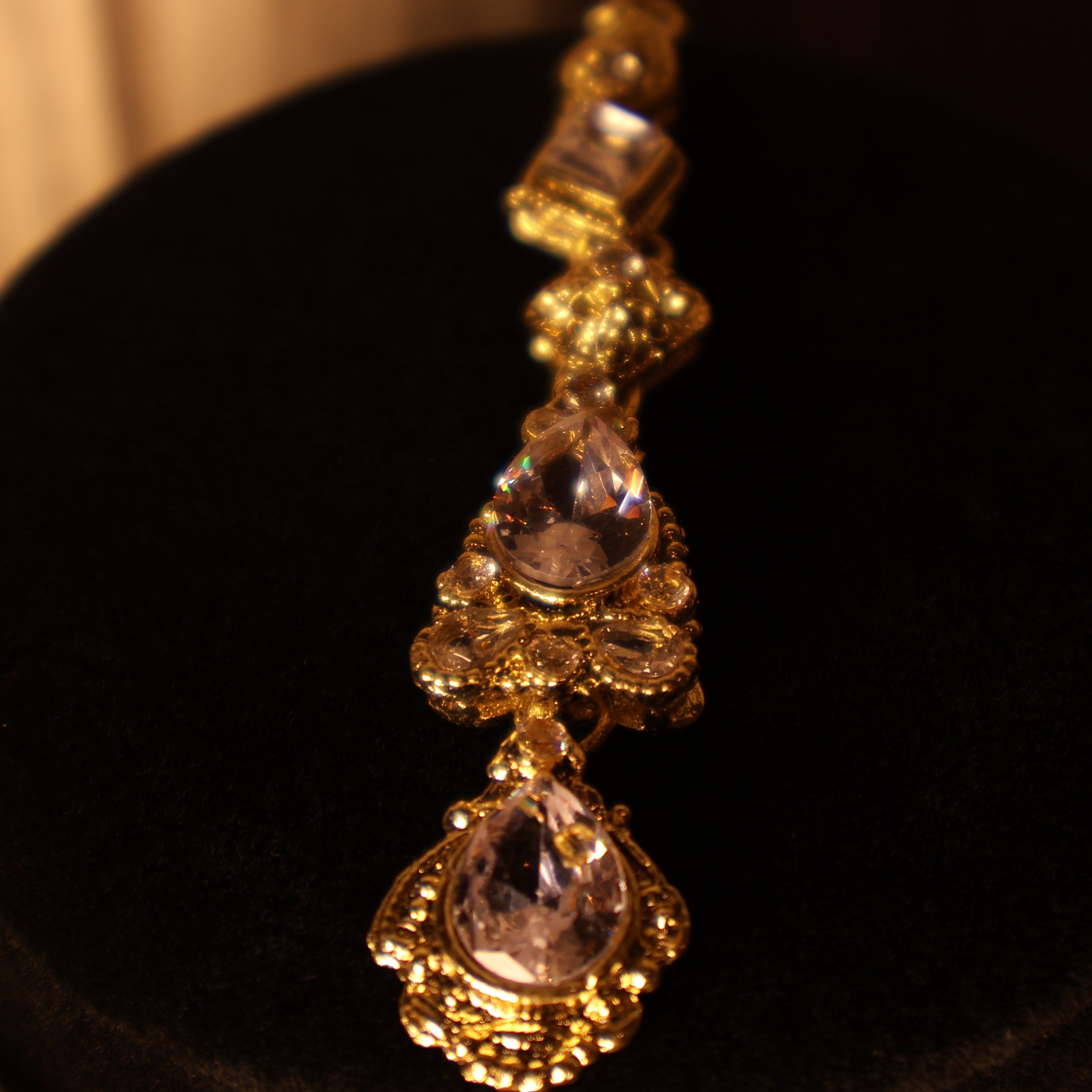 NAAZ light pink and gold kundan-style choker set with tikka and earrings
