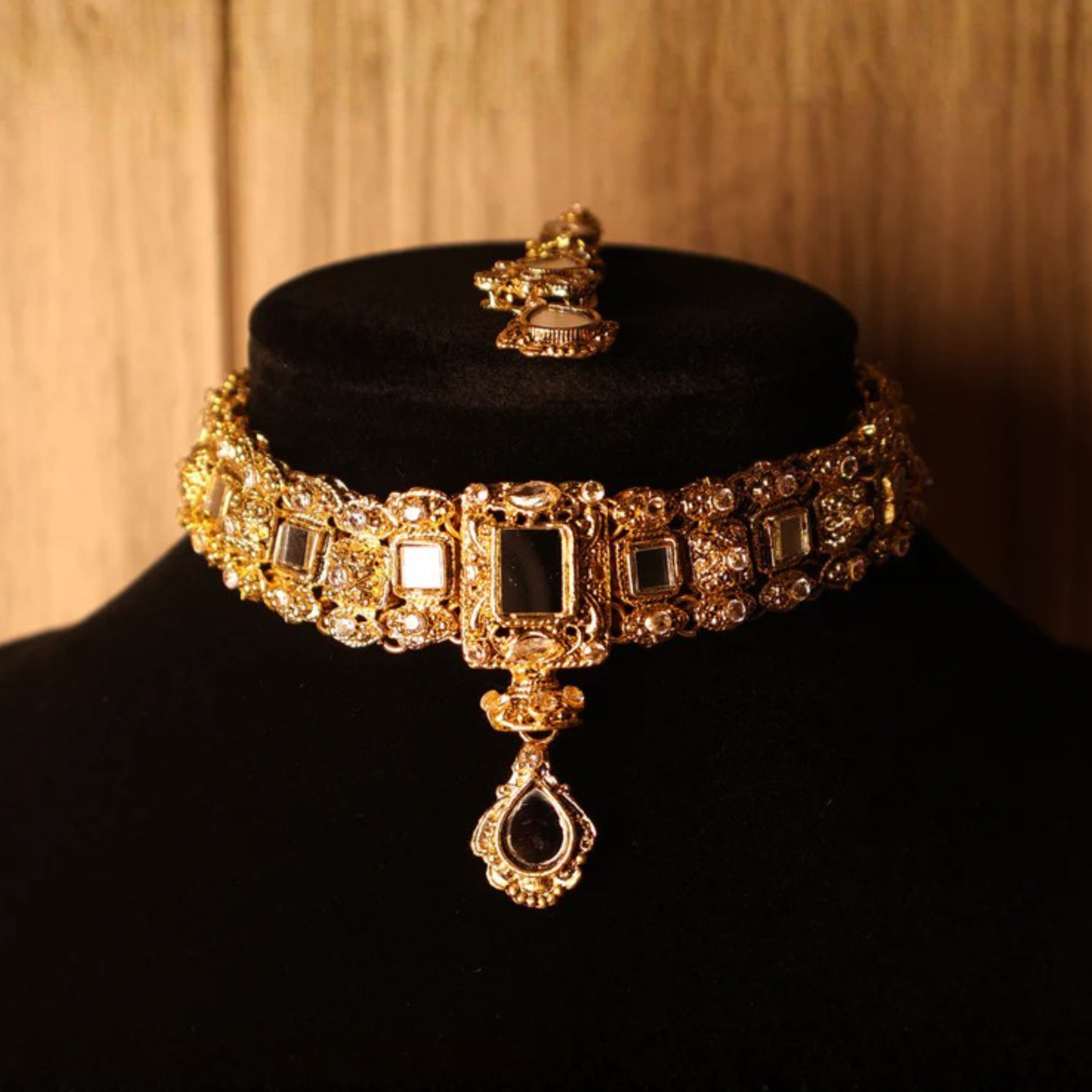 AAINA mirror-cut gold kundan-style choker set with tikka and earrings