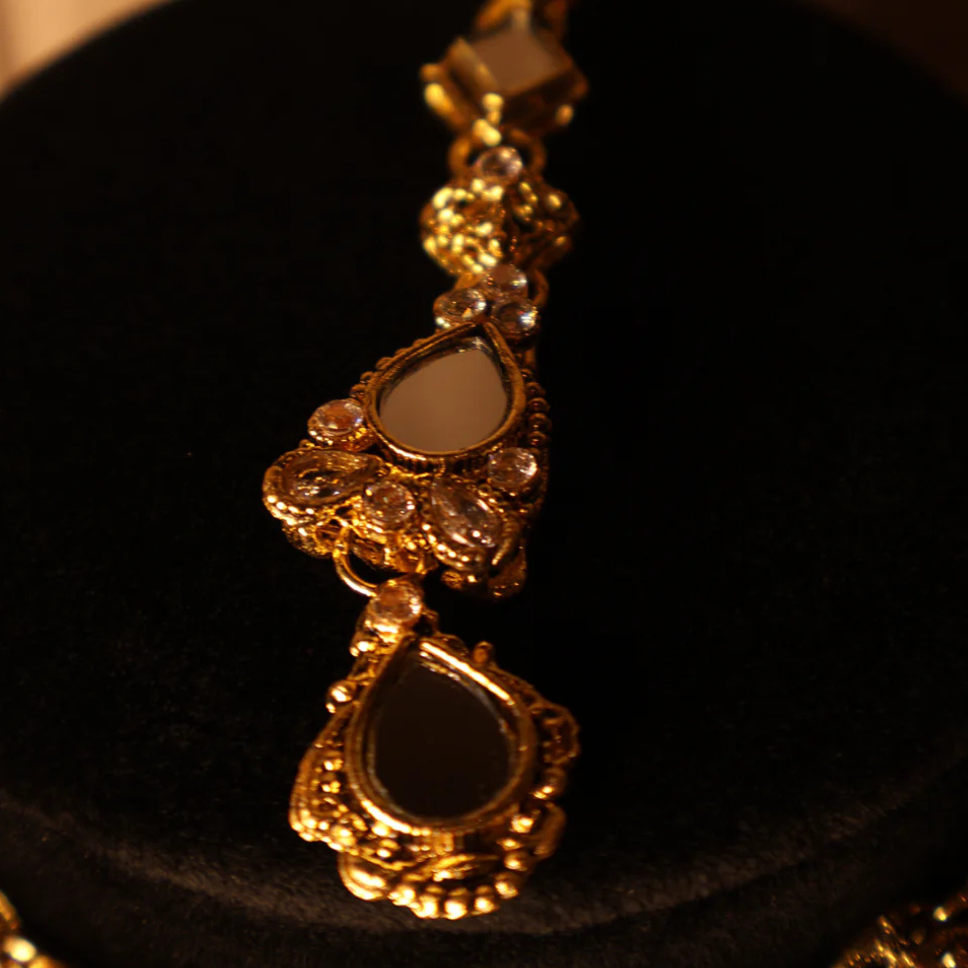 AAINA mirror-cut gold kundan-style choker set with tikka and earrings
